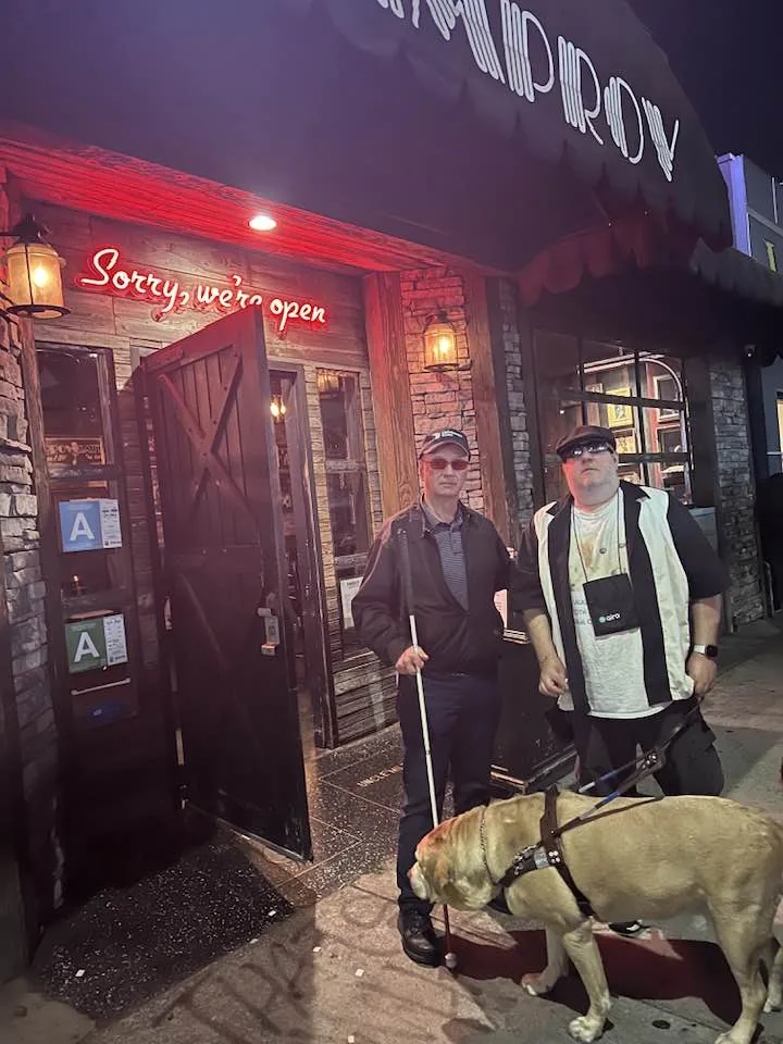 Ed, Brian and his guide dog Wesley outside the Hollywood Improv.
