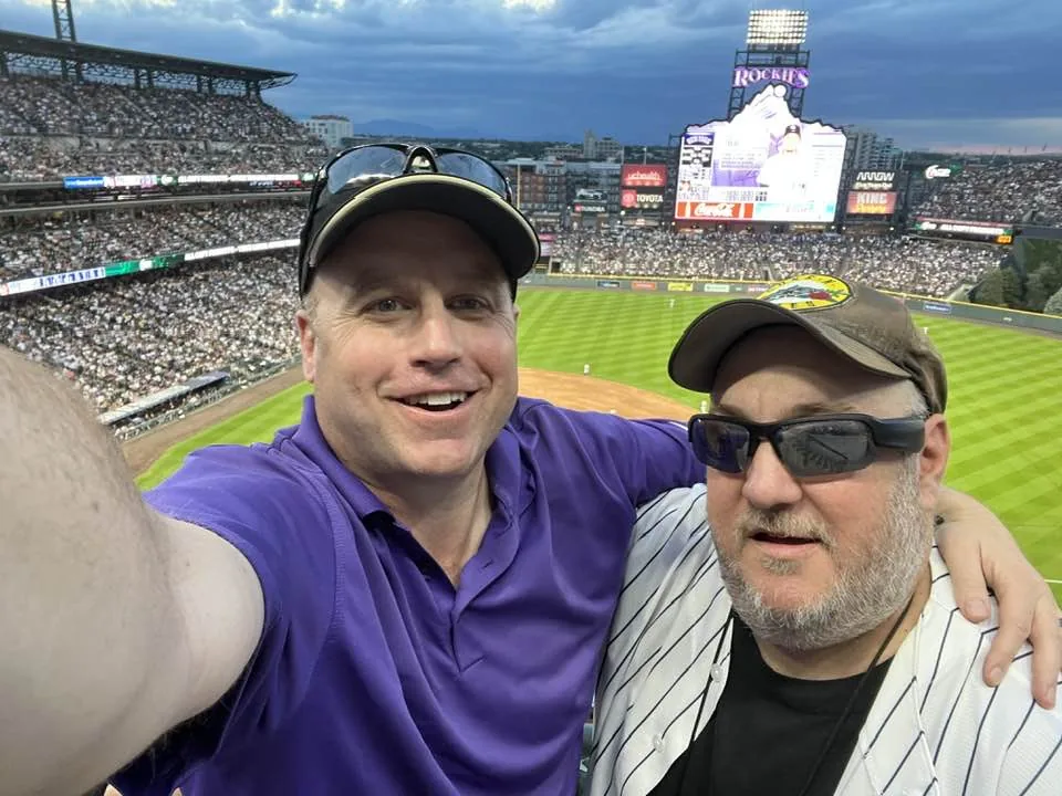 Cameron and Brian take a selfie at Coors Field.