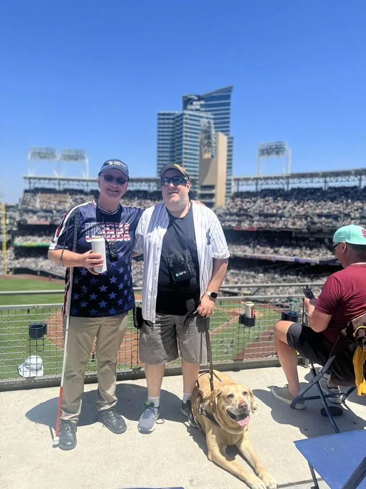 Ed, Brian and his guide dog Wesley at Petco Park.